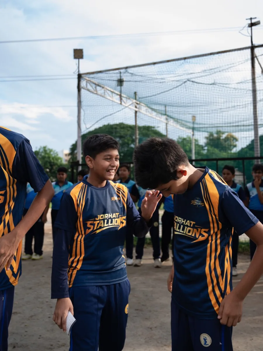 Two young players in Stallions kit sharing a laugh