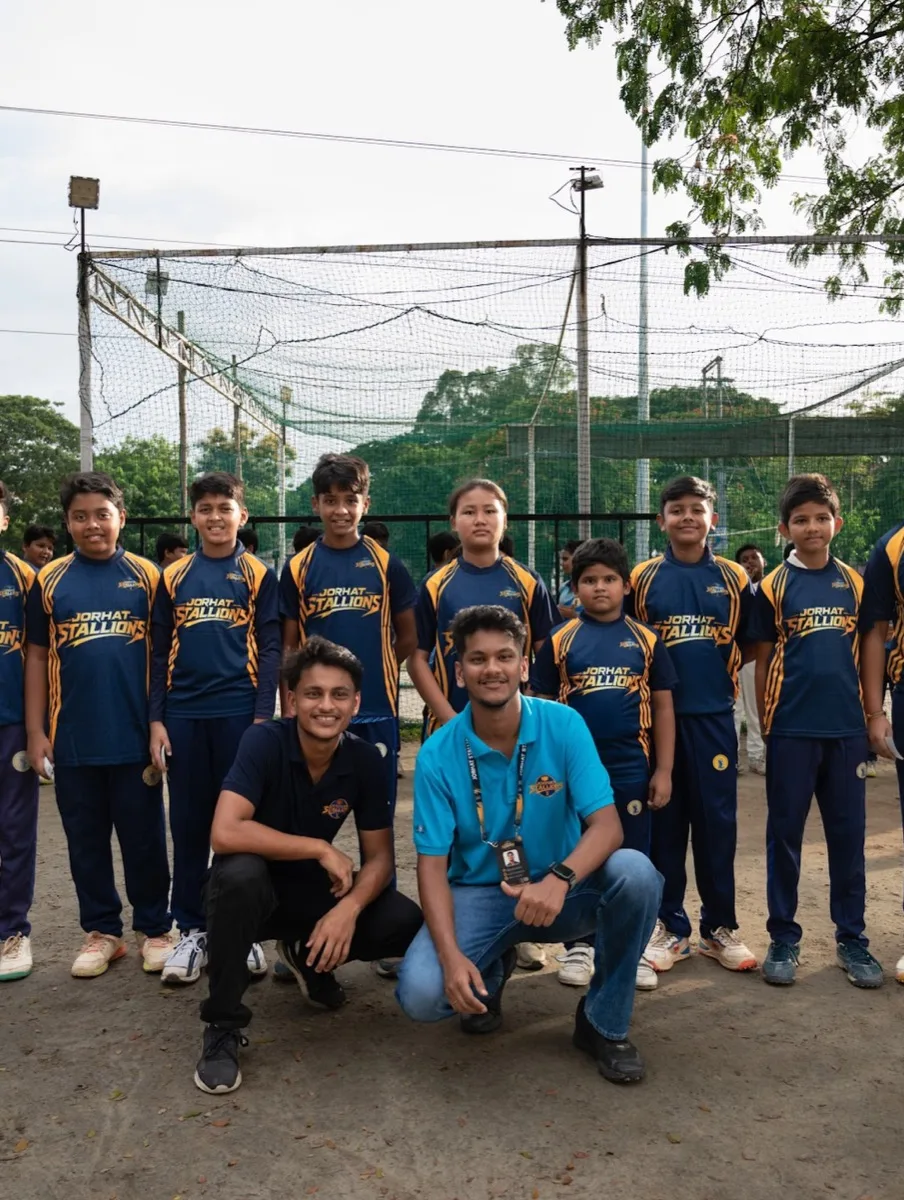 The junior squad and coaches together at the ground