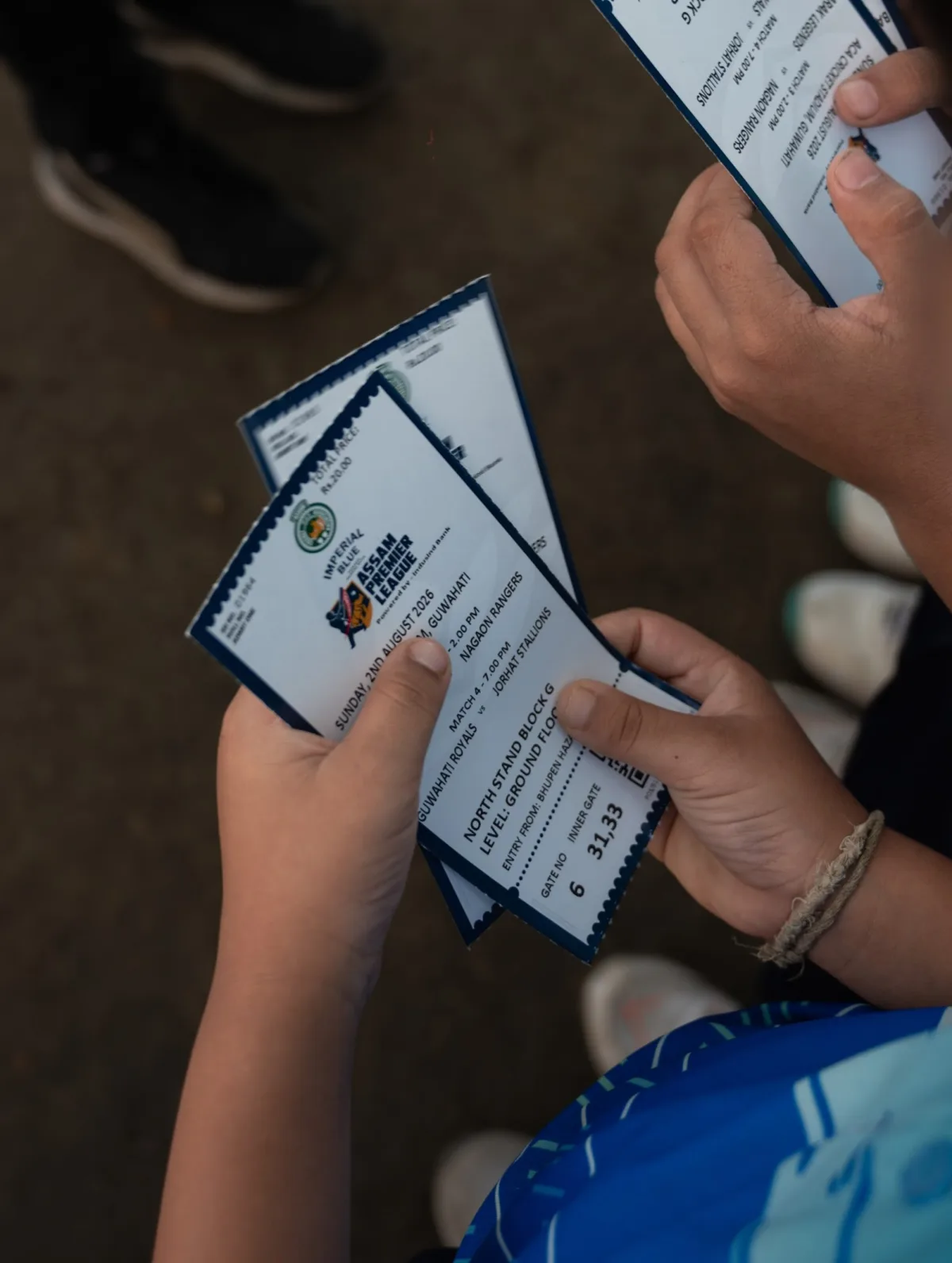 Assam Premier League tickets held in a supporter's hands
