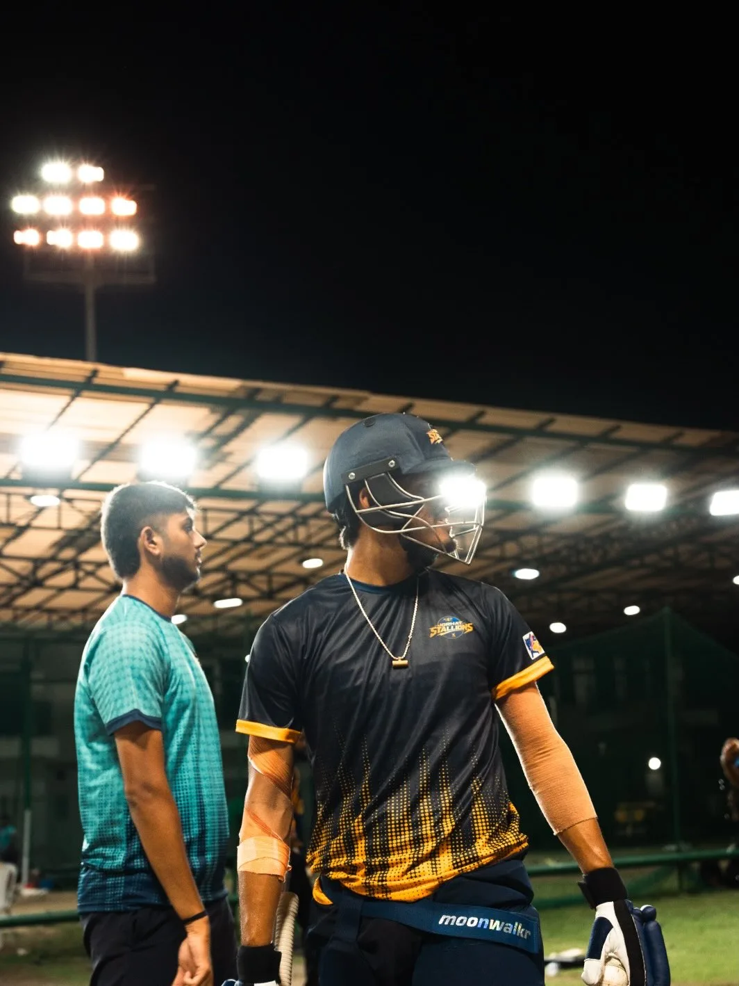 Two players talking at the boundary after a session