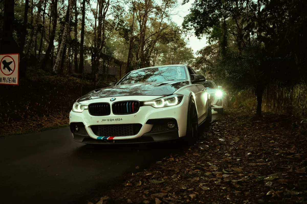 Modified BMW 3 series on a forest road