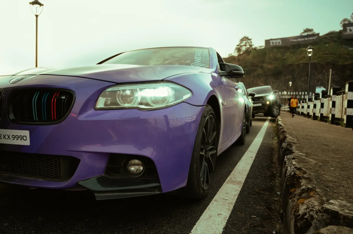 Purple BMW 5 series at night