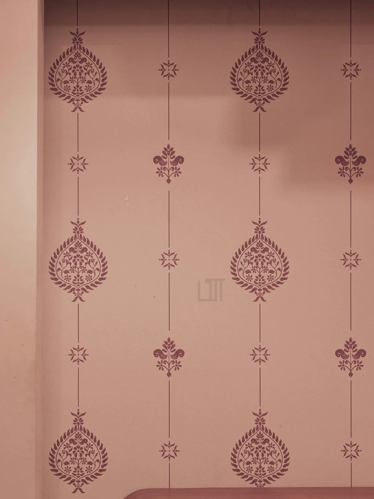 Hand-stencilled wallpaper motifs