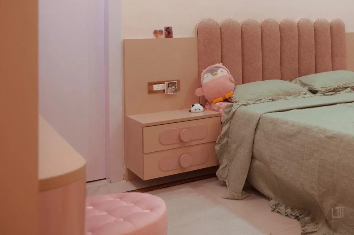 Blush bedroom with channel-tufted headboard